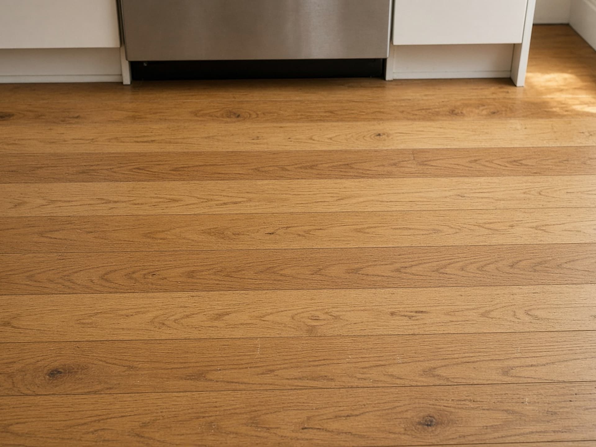 The same square metre with grain-matched boards let in and blended, the repair no longer findable.